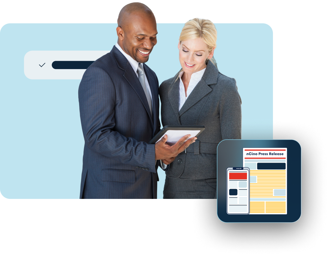 African man and woman reading on an iPad